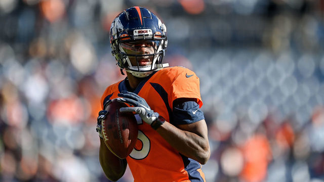 DENVER, CO - DECEMBER 19: Denver Broncos quarterback Teddy Bridgewater (5) throws as he warms up before a game between the Denver Broncos and the Cincinnati Bengals at Empower Field at Mile High on December 19, 2021 in Denver, Colorado.