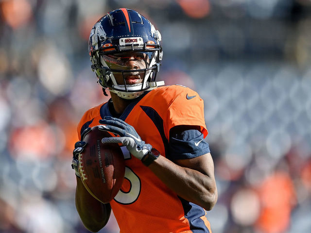 Quarterback Teddy Bridgewater of the Denver Broncos runs out of the News  Photo - Getty Images