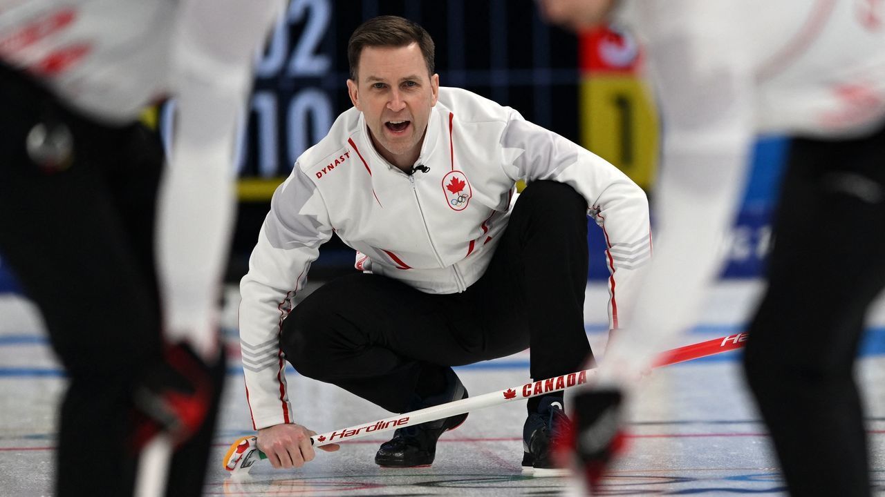 Canada's Brad Gushue gives instructions to teammates during the men's semifinal game of the Beijing 2022 Winter Olympic Games curling competition against Sweden at the National Aquatics Centre in Beijing on February 17, 2022.