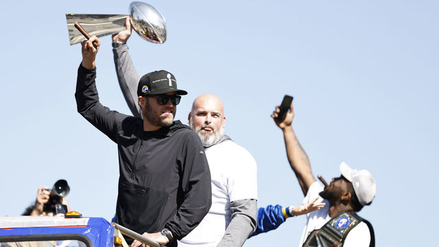 LOS ANGELES, CALIFORNIA - FEBRUARY 16: Matthew Stafford #9 of the Los Angeles Rams and Andrew Whitworth #77 of the Los Angeles Rams celebrate during the Super Bowl LVI Victory Parade on February 16, 2022 in Los Angeles, California.