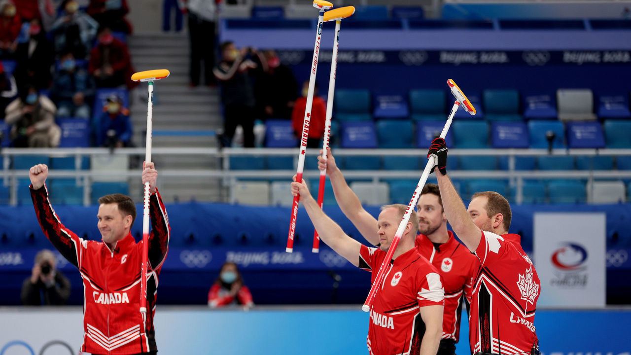 BEIJING, CHINA - FEBRUARY 18: (L-R) Brad Gushue, Mark Nichols, Brett Gallant and Geoff Walker of Team Canada celebrate their victory against Team United States during the Men's Curling Bronze Medal Game on Day 14 of the Beijing 2022 Winter Olympic Games at National Aquatics Centre on February 18, 2022 in Beijing, China.