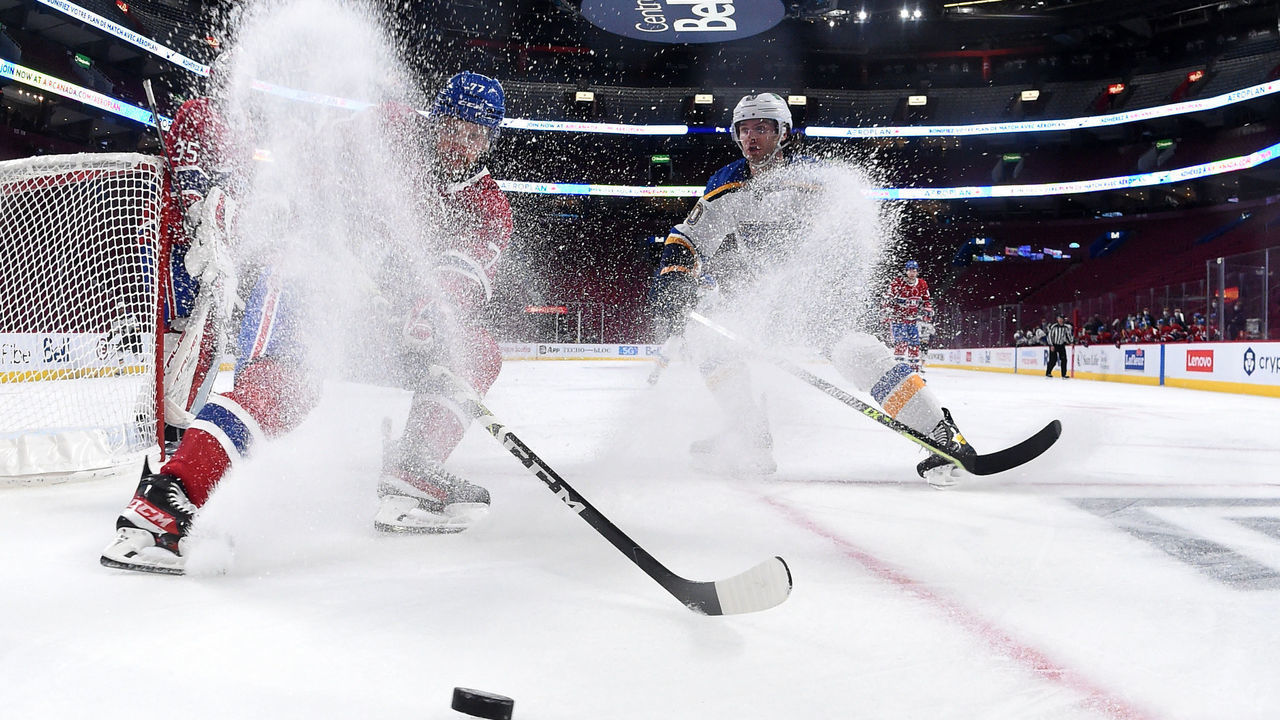 MONTREAL, QC - FEBRUARY 17: Brett Kulak #77 of the Montreal Canadiens controls the puck against Brandon Saad #20 of the St. Louis Blues in the NHL game at the Bell Centre on February 17, 2022 in Montreal, Quebec, Canada.