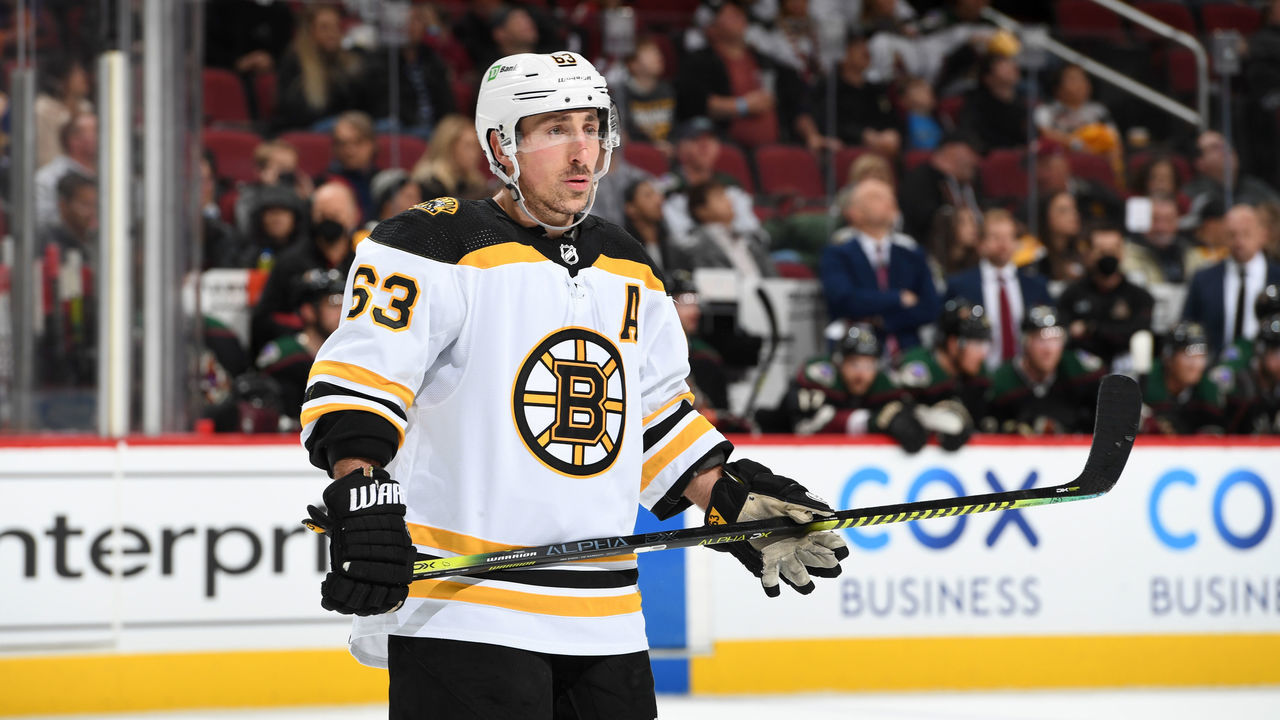 GLENDALE, ARIZONA - JANUARY 28: Brad Marchand #63 of the Boston Bruins gets ready during a face off against the Arizona Coyotes at Gila River Arena on January 28, 2022 in Glendale, Arizona.