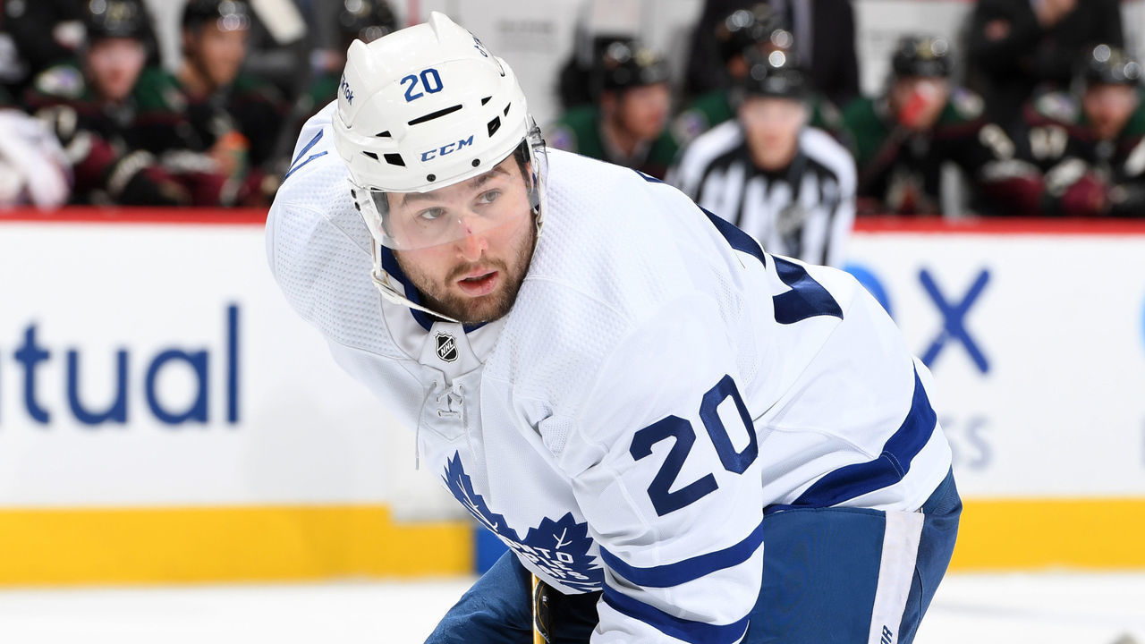 GLENDALE, ARIZONA - JANUARY 12: Nick Ritchie #20 of the Toronto Maple Leafs gets ready during a face off against the Arizona Coyotes at Gila River Arena on January 12, 2022 in Glendale, Arizona.