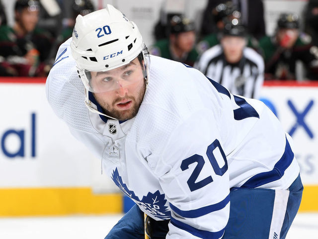 GLENDALE, ARIZONA - JANUARY 12: Nick Ritchie #20 of the Toronto Maple Leafs gets ready during a face off against the Arizona Coyotes at Gila River Arena on January 12, 2022 in Glendale, Arizona.