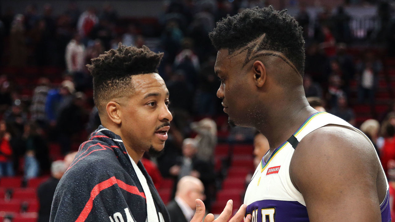PORTLAND, OREGON - FEBRUARY 21: CJ McCollum #3 of the Portland Trail Blazers and Zion Williamson #1 of the New Orleans Pelicans shake hands after the New Orleans Pelicans defeated the Portland Trail Blazers 128-115 during their game at Moda Center on February 21, 2020 in Portland, Oregon.