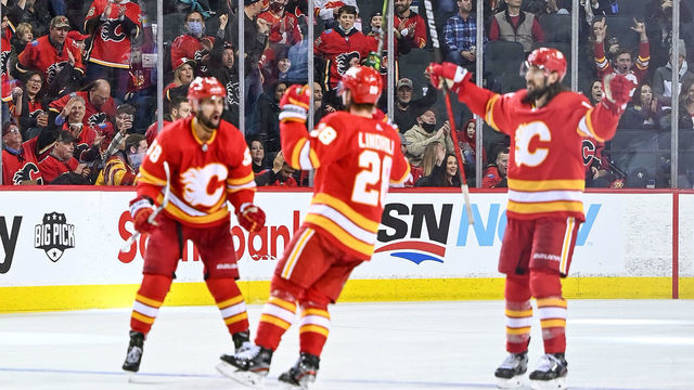 CALGARY, AB - FEBRUARY 19: Calgary Flames fans celebrate a goal by Calgary Flames Center Elias Lindholm (28) during the third period of an NHL game where the Calgary Flames hosted the Seattle Kraken on February 19, 2022, at the Scotiabank Saddledome in Calgary, AB.