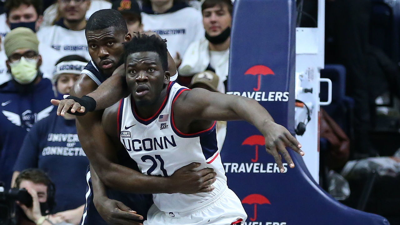 STORRS, CT - JANUARY 25: UConn Huskies forward Adama Sanogo (21) battle for position against Georgetown Hoyas center Timothy Ighoefe (5) during a college basketball game between Georgetown Hoyas and UConn Huskies on January 25, 2022, at Harry A. Gampel Pavilion in Storrs, CT.