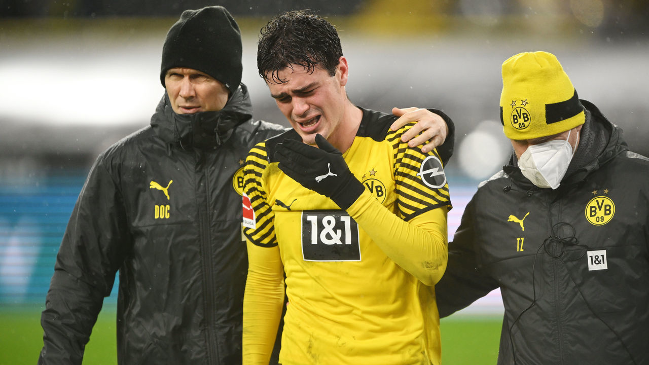 DORTMUND, GERMANY - FEBRUARY 20: Giovanni Reyna (C) of Dortmund is injured during the Bundesliga match between Borussia Dortmund and Borussia Mönchengladbach at Signal Iduna Park on February 20, 2022 in Dortmund, Germany.