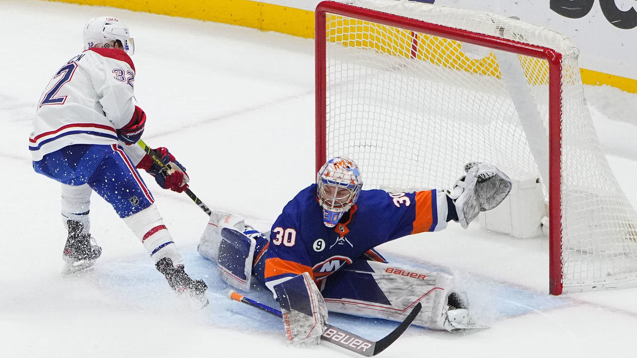 ELMONT, NY - FEBRUARY 20: Montreal Canadiens Winger Rem Pitlick (32) scores a goal on New York Islanders Goalie Ilya Sorokin (30) during the shootout period of the National Hockey League game between the Montrel Canadiens on February 20, 2022, at UBS Arena in Elmont, NY.