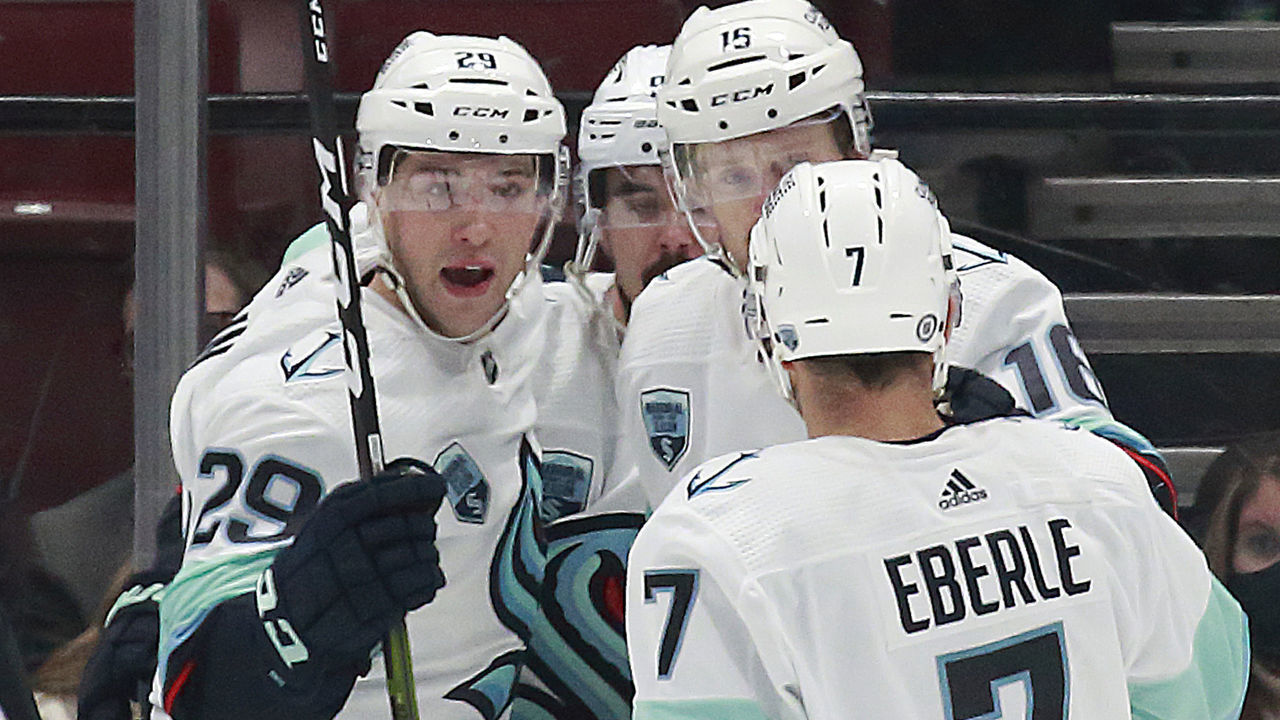 VANCOUVER, BC - FEBRUARY 21: Jared McCann #16 of the Seattle Kraken is congratulated by teammates after scoring during their NHL game against the Vancouver Canucks at Rogers Arena February 21, 2022 in Vancouver, British Columbia, Canada.