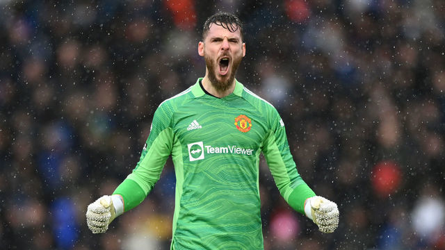 LEEDS, ENGLAND - FEBRUARY 20: David De Gea celebrates after Bruno Fernandes of Manchester United (not pictured) scored their sides second goal during the Premier League match between Leeds United and Manchester United at Elland Road on February 20, 2022 in Leeds, England.