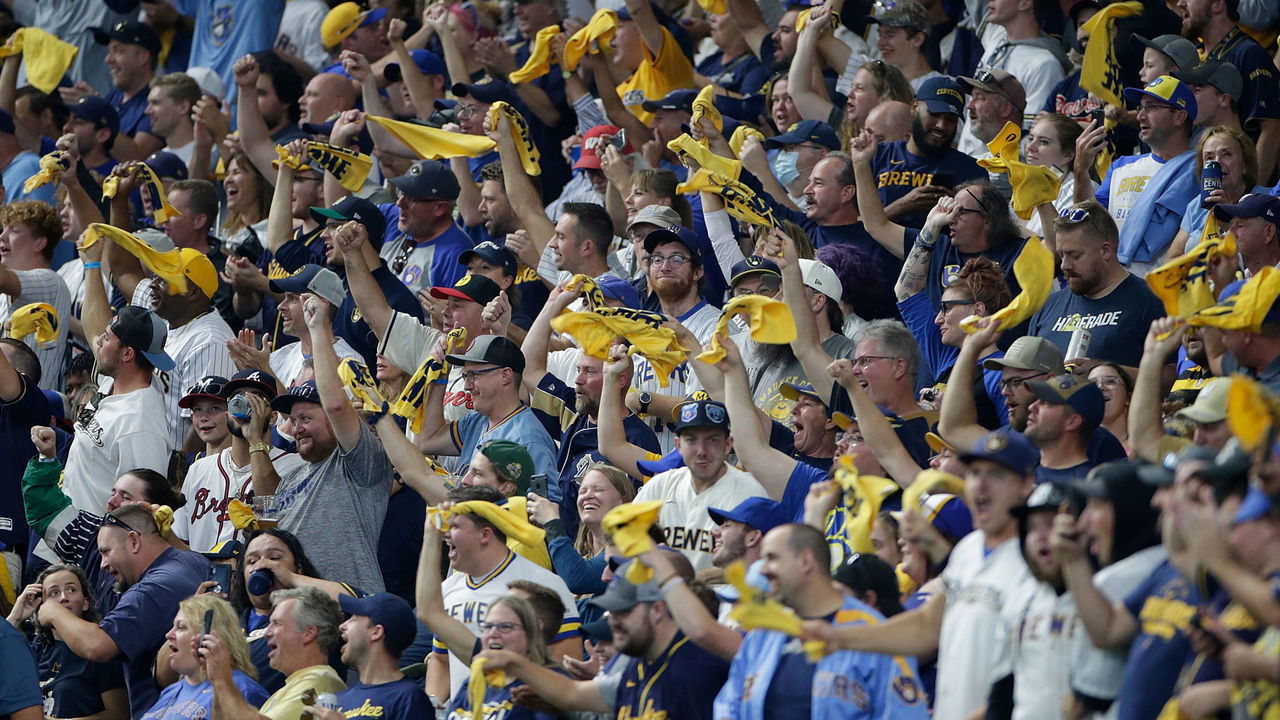 MILWAUKEE, WISCONSIN - OCTOBER 08: Brewers fans wave the yellow towel during Game One of the National League division series against the Atlanta Braves at American Family Field on October 08, 2021 in Milwaukee, Wisconsin. Brewers defeated the Braves 2-1.