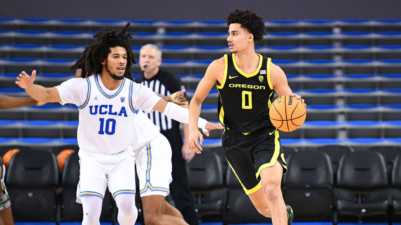 LOS ANGELES, CA - JANUARY 13: Oregon Ducks guard Will Richardson (0) guarded by UCLA Bruins guard Tyger Campbell (10) during a college basketball game between the Oregon Ducks and the UCLA Bruins on January 13, 2022, at Pauley Pavilion in Los Angeles, CA.