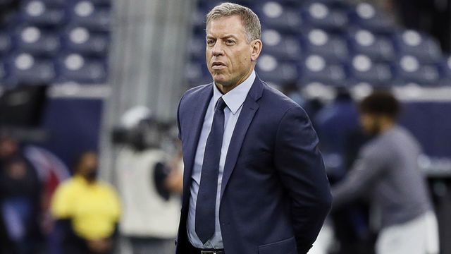 HOUSTON, TEXAS - SEPTEMBER 23: NFL on FOX personality Troy Aikman watches warm ups prior to a game between the Carolina Panthers and the Houston Texans at NRG Stadium on September 23, 2021 in Houston, Texas.