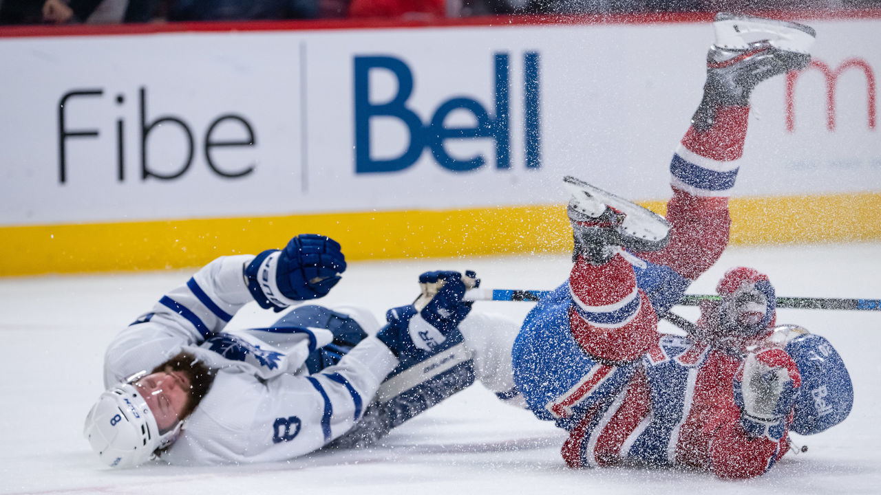 MONTREAL, QC - FEBRUARY 21: Chris Wideman (20) of the Montreal Canadiens collides with Jake Muzzin (8) of the Toronto Maple Leafs during the second period of the NHL game between the Toronto Maple Leafs and the Montreal Canadiens on February 21, 2022, at the Bell Centre in Montreal, QC