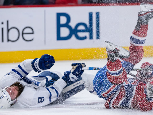 MONTREAL, QC - FEBRUARY 21: Chris Wideman (20) of the Montreal Canadiens collides with Jake Muzzin (8) of the Toronto Maple Leafs during the second period of the NHL game between the Toronto Maple Leafs and the Montreal Canadiens on February 21, 2022, at the Bell Centre in Montreal, QC
