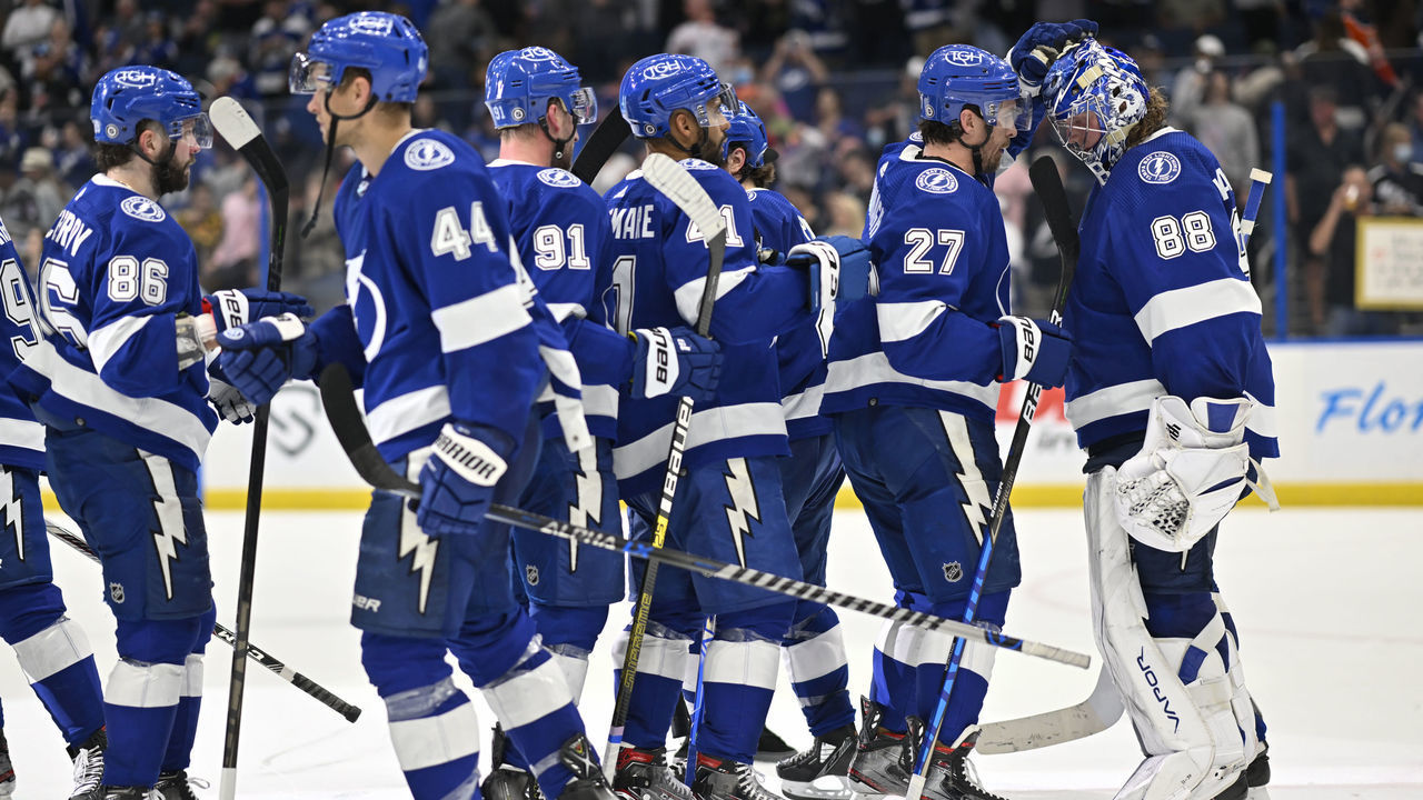 TAMPA, FL - FEBRUARY 23: Tampa Bay Lightning Goalie Andrei Vasilevskiy (88) is congratulated for a victory by Tampa Bay Lightning Defenceman Ryan McDonagh (27) and teammates after a game between the Edmonton Oilers and the Tampa Bay Lightning on February 23, 2021, at Amalie Arena in Tampa, FL.