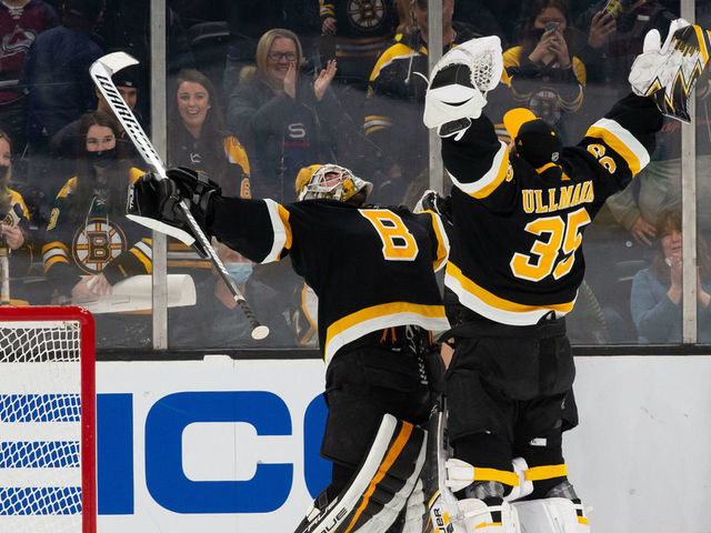 BOSTON, MA - FEBRUARY 21: Jeremy Swayman #1 of the Boston Bruins and teammate Linus Ullmark #35 celebrate a 5-1 victory against the Colorado Avalanche at the TD Garden on February 21, 2022 in Boston, Massachusetts.