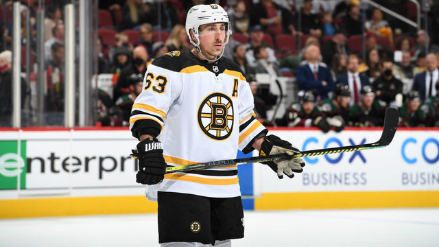 GLENDALE, ARIZONA - JANUARY 28: Brad Marchand #63 of the Boston Bruins gets ready during a face off against the Arizona Coyotes at Gila River Arena on January 28, 2022 in Glendale, Arizona.