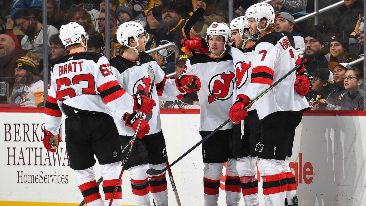 PITTSBURGH, PA - FEBRUARY 24: Nico Hischier #13 of the New Jersey Devils celebrates his goal with teammates during the third period against the Pittsburgh Penguins at PPG PAINTS Arena on February 24, 2022 in Pittsburgh, Pennsylvania.