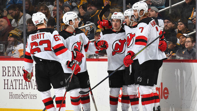 PITTSBURGH, PA - FEBRUARY 24: Nico Hischier #13 of the New Jersey Devils celebrates his goal with teammates during the third period against the Pittsburgh Penguins at PPG PAINTS Arena on February 24, 2022 in Pittsburgh, Pennsylvania.