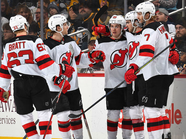 PITTSBURGH, PA - FEBRUARY 24: Nico Hischier #13 of the New Jersey Devils celebrates his goal with teammates during the third period against the Pittsburgh Penguins at PPG PAINTS Arena on February 24, 2022 in Pittsburgh, Pennsylvania.