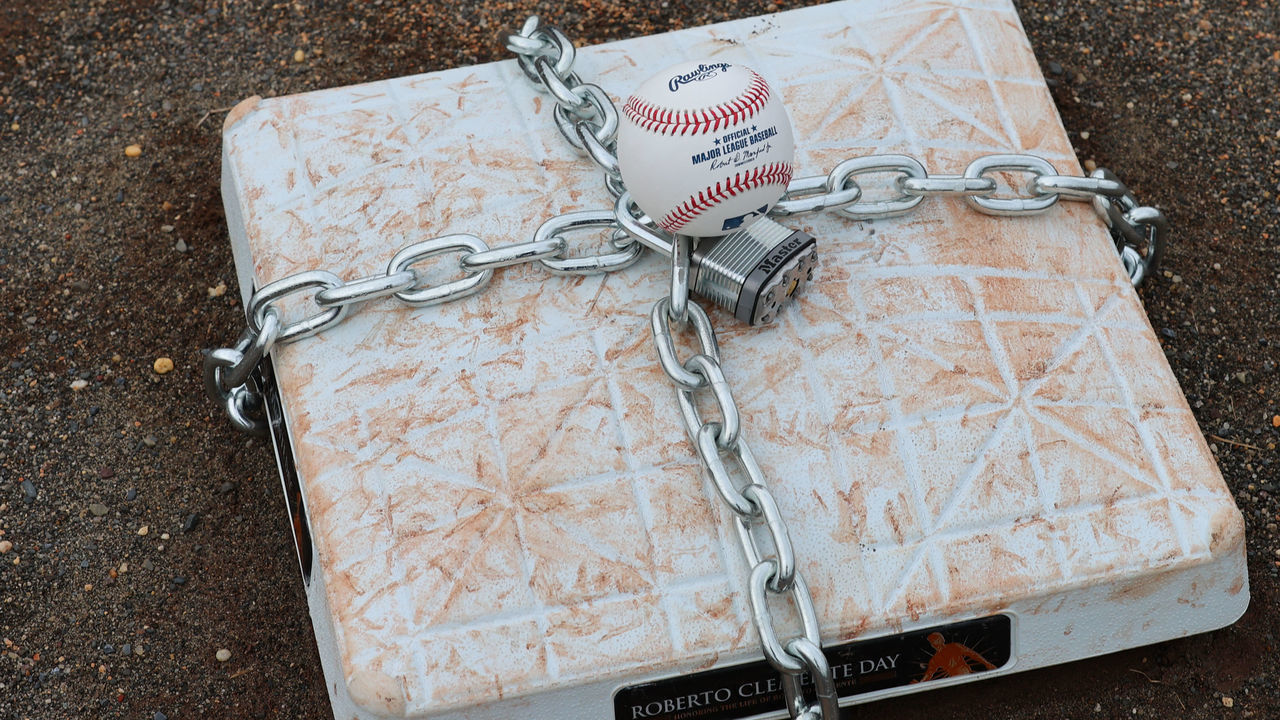 LINCROFT, NJ - JANUARY 28: An official MLB baseball sits on top of an MLB game-used base with a lock and chain around it to represent the lockout between Major League Baseball (MLB) and the Major League Baseball Players Association (MLBPA) on January 28, 2022 in Lincroft, New Jersey.