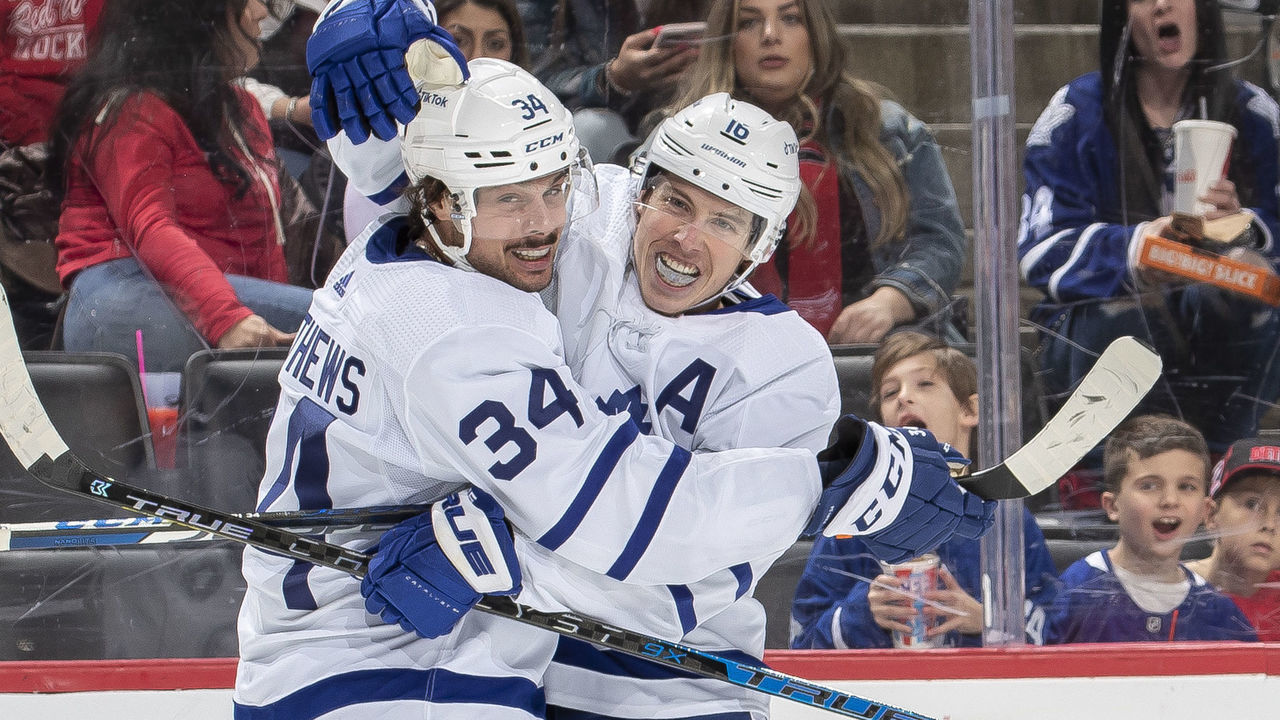 DETROIT, MI - FEBRUARY 26: Auston Matthews #34 of the Toronto Maple Leafs congratulates teammate Mitchell Marner #16 for scoring a goal during the second period of an NHL game against the Detroit Red Wings at Little Caesars Arena on February 26, 2022 in Detroit, Michigan.