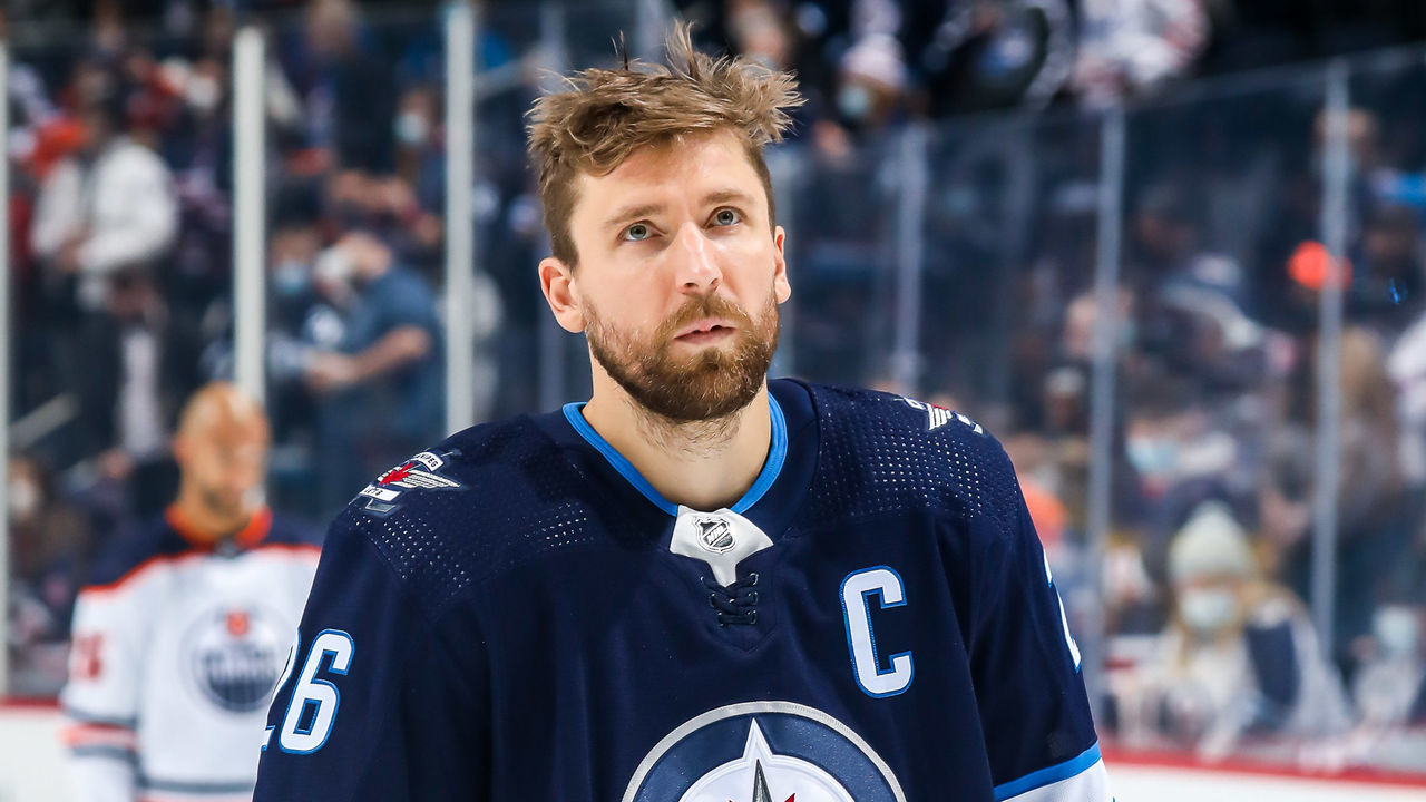 WINNIPEG, MB - FEBRUARY 19: Blake Wheeler #26 of the Winnipeg Jets looks on during the singing of 'O Canada' prior to puck drop against the Edmonton Oilers at the Canada Life Centre on February 19, 2022 in Winnipeg, Manitoba, Canada.