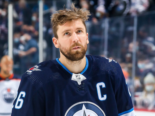 WINNIPEG, MB - FEBRUARY 19: Blake Wheeler #26 of the Winnipeg Jets looks on during the singing of 'O Canada' prior to puck drop against the Edmonton Oilers at the Canada Life Centre on February 19, 2022 in Winnipeg, Manitoba, Canada.