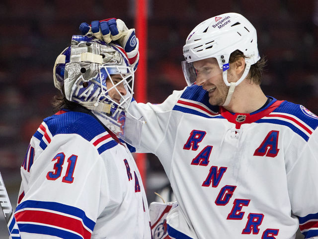 OTTAWA, ON - FEBRUARY 20: Igor Shesterkin #31 of the New York Rangers celebrates a 2-1 win against the Ottawa Senators with his teammate Jacob Trouba #8 at Canadian Tire Centre on February 20, 2022 Ottawa, Ontario, Canada