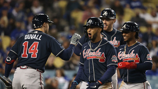 LOS ANGELES, CALIFORNIA - OCTOBER 20: Eddie Rosario #8 of the Atlanta Braves celebrates a three run home run during the ninth inning of Game Four of the National League Championship Series against the Los Angeles Dodgers at Dodger Stadium on October 20, 2021 in Los Angeles, California.