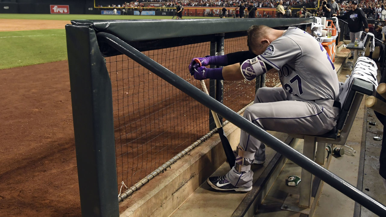 PHOENIX, AZ - OCTOBER 4: Colorado Rockies shortstop Trevor Story (27) sits dejected in the dugout after their loss to the Arizona Diamondbacks 11-8 during the NL Wild Card Game on October 4, 2017 in Phoenix, AZ at Chase Field.