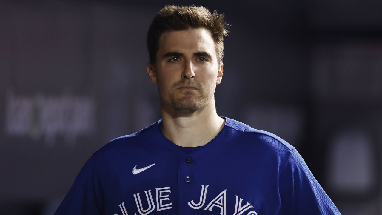 MIAMI, FLORIDA - JUNE 22: Ross Stripling #48 of the Toronto Blue Jays looks on from the dugout against the Miami Marlins at loanDepot park on June 22, 2021 in Miami, Florida.