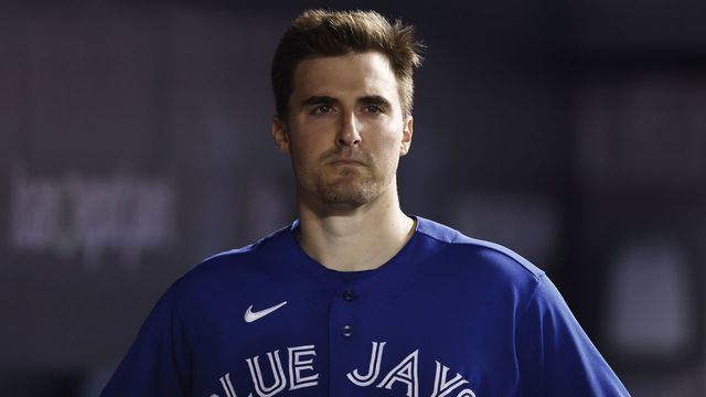 MIAMI, FLORIDA - JUNE 22: Ross Stripling #48 of the Toronto Blue Jays looks on from the dugout against the Miami Marlins at loanDepot park on June 22, 2021 in Miami, Florida.