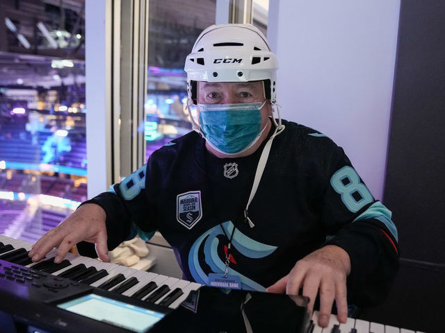 SEATTLE, WASHINGTON - JANUARY 01: Rod Masters from the movie Slapshot plays the organ before a game between the Seattle Kraken and Vancouver Canucks at Climate Pledge Arena on January 01, 2022 in Seattle, Washington.