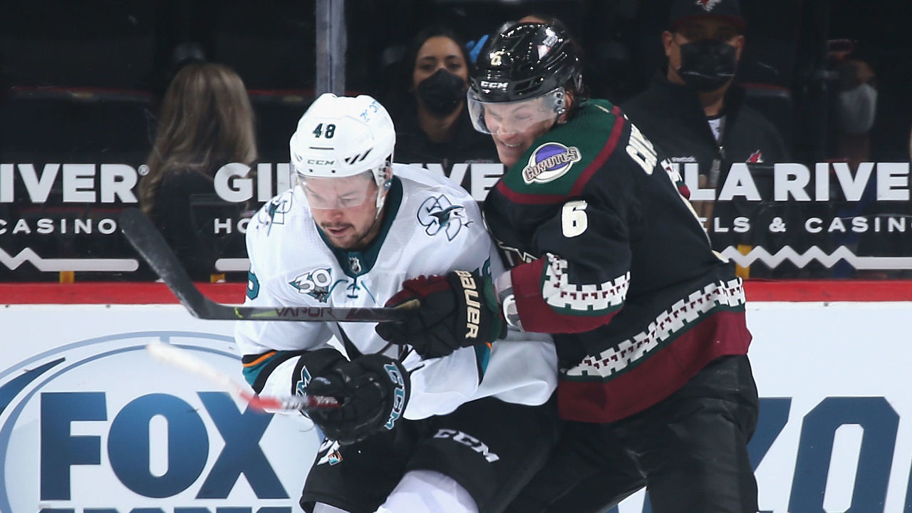 GLENDALE, ARIZONA - JANUARY 14: Tomas Hertl #48 of the San Jose Sharks battles for the puck with Jakob Chychrun #6 of the Arizona Coyotes during the NHL game at Gila River Arena on January 14, 2021 in Glendale, Arizona. The Sharks defeated the Coyotes 4-3 in an overtime shoot-out.