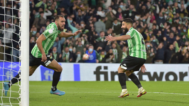 Real Betis' Spanish forward Borja Iglesias (L) celebrates after scoring a goal during the Copa del Rey (King's Cup) semi final second leg football match between Real Betis and Rayo Vallecano de Madrid at the Benito Villamarin stadium in Seville on March 3, 2022.