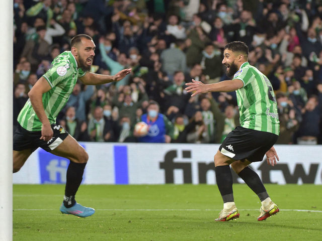 Real Betis' Spanish forward Borja Iglesias (L) celebrates after scoring a goal during the Copa del Rey (King's Cup) semi final second leg football match between Real Betis and Rayo Vallecano de Madrid at the Benito Villamarin stadium in Seville on March 3, 2022.