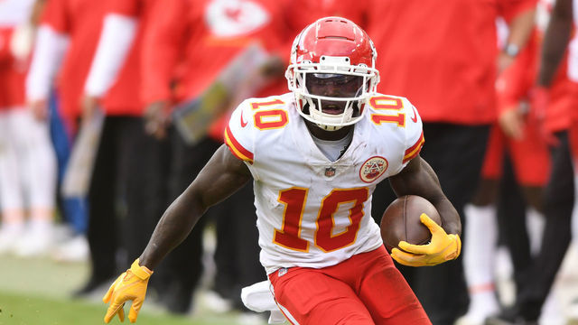 LANDOVER, MARYLAND - OCTOBER 17: Tyreek Hill #10 of the Kansas City Chiefs runs with the ball during a NFL football game against the Washington Football Team at FedExField on October 17, 2021 in Landover, Maryland.