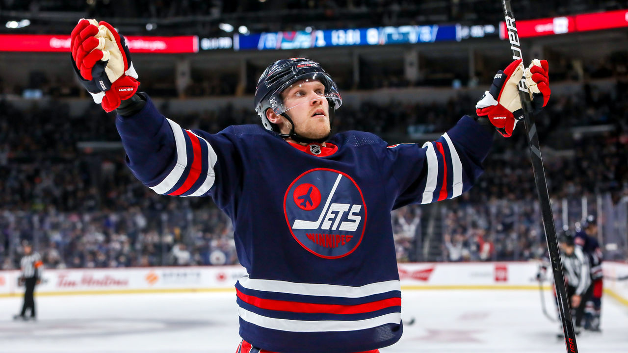 WINNIPEG, MB - NOVEMBER 16: Nikolaj Ehlers #27 of the Winnipeg Jets celebrates his second period goal against the Edmonton Oilers at Canada Life Centre on November 16, 2021 in Winnipeg, Manitoba, Canada.