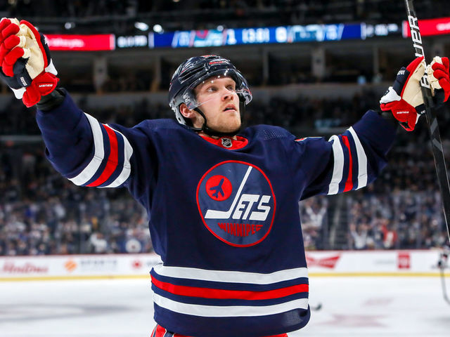 WINNIPEG, MB - NOVEMBER 16: Nikolaj Ehlers #27 of the Winnipeg Jets celebrates his second period goal against the Edmonton Oilers at Canada Life Centre on November 16, 2021 in Winnipeg, Manitoba, Canada.