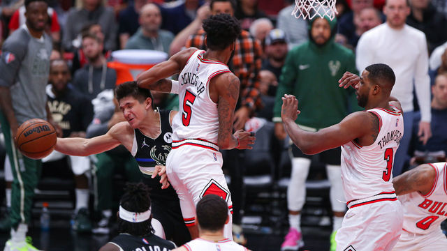 CHICAGO, IL - MARCH 04: Milwaukee Bucks guard Grayson Allen (7) is elbowed in the head by Chicago Bulls forward Derrick Jones Jr. (5) during a NBA game between the Milwaukee Bucks and the Chicago Bulls on March 4, 2022 at the United Center in Chicago, IL.