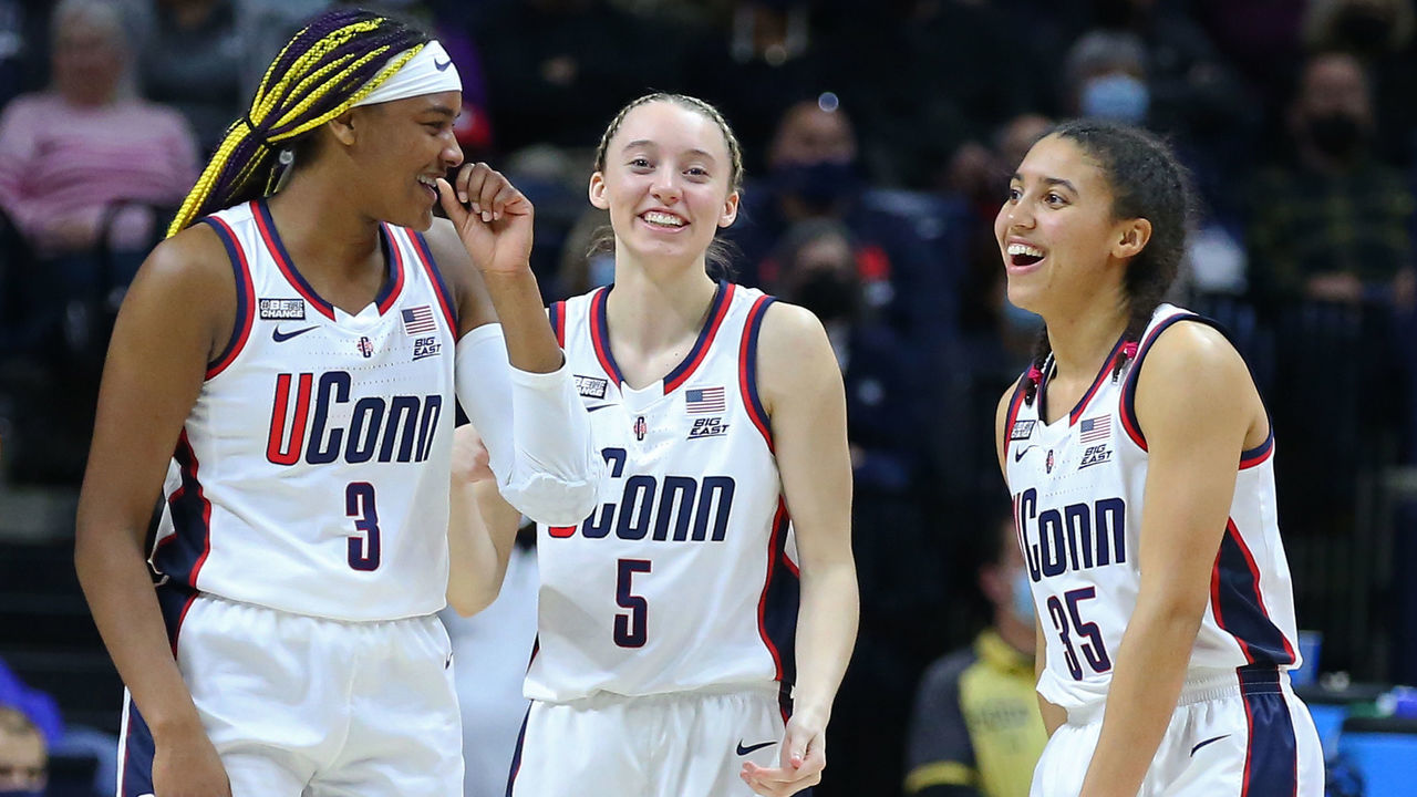 STORRS, CT - FEBRUARY 27: UConn Huskies forward Aaliyah Edwards (3), UConn Huskies guard Paige Bueckers (5) and UConn Huskies guard Azzi Fudd (35) share a laugh during a college basketball game between Providence Friars and UConn Huskies on February 27 2022, at Harry A. Gampel Pavilion in Storrs, CT.
