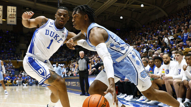 DURHAM, NORTH CAROLINA - MARCH 05: Caleb Love #2 of the North Carolina Tar Heels drives against Trevor Keels #1 of the Duke Blue Devils during the first half at Cameron Indoor Stadium on March 05, 2022 in Durham, North Carolina.