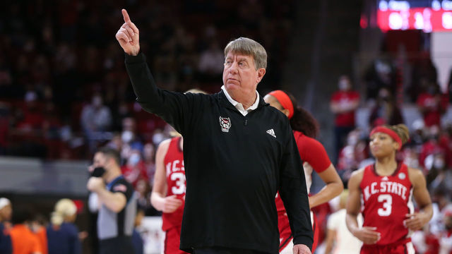RALEIGH, NC - FEBRUARY 20: NC State Wolfpack head coach Wes Moore points as timeout is called during the womens college basketball game between the Syracuse Orange and the NC State Wolfpack on February 20, 2022, at Reynolds Coliseum in Raleigh, NC.