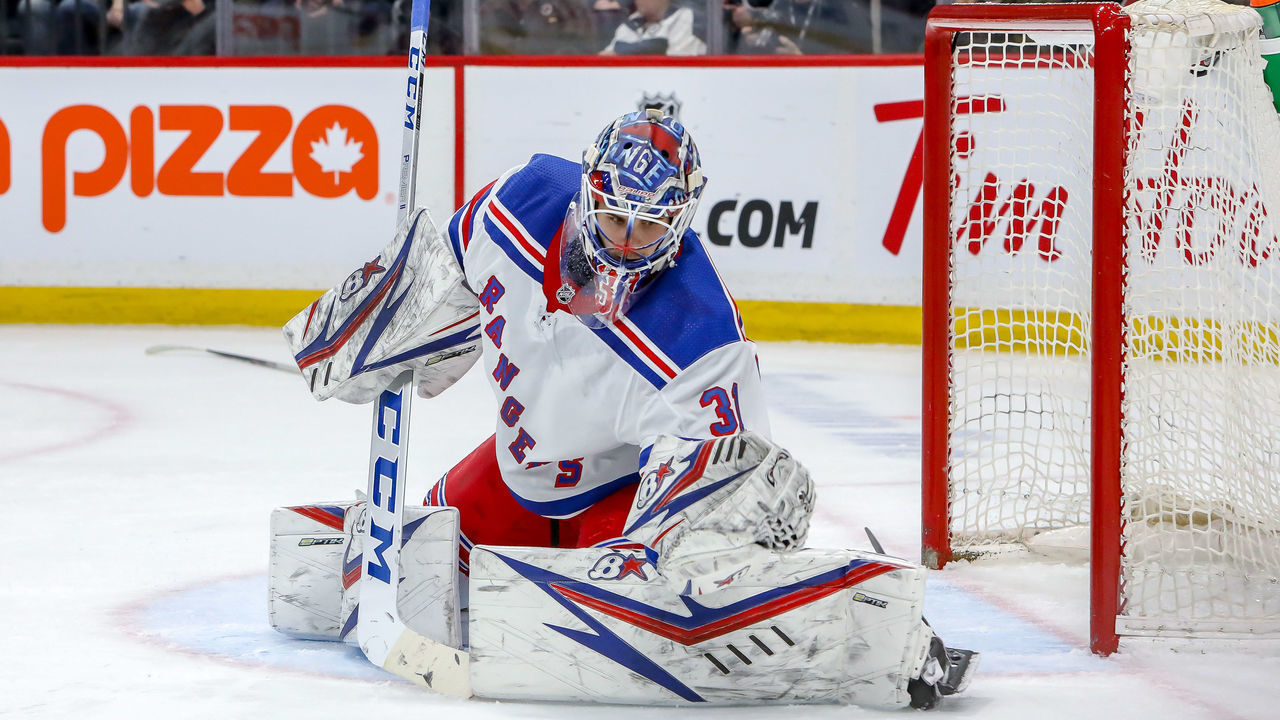 WINNIPEG, MB - FEBRUARY 11: Goaltender Igor Shesterkin #31 of the New York Rangers catches the puck during third period action against the Winnipeg Jets at the Bell MTS Place on February 11, 2020 in Winnipeg, Manitoba, Canada. The Rangers defeated the Jets 4-1.