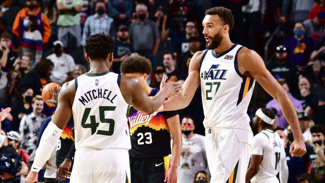 PHOENIX, AZ - FEBRUARY 27: Donovan Mitchell #45 of the Utah Jazz high fives Rudy Gobert #27 of the Utah Jazz during the game against the Phoenix Suns on February 27, 2022 at Footprint Center in Phoenix, Arizona. Mandatory Copyright Notice: Copyright 2022 NBAE
