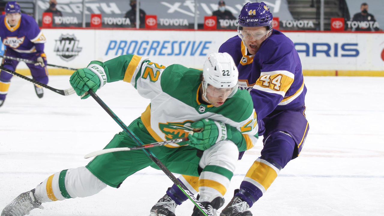 SAINT PAUL, MN - FEBRUARY 27: Kevin Fiala #22 of the Minnesota Wild is called for holding the stick against Mikey Anderson #44 of the Los Angeles Kings during the game at the Xcel Energy Center on February 27, 2021 in Saint Paul, Minnesota.
